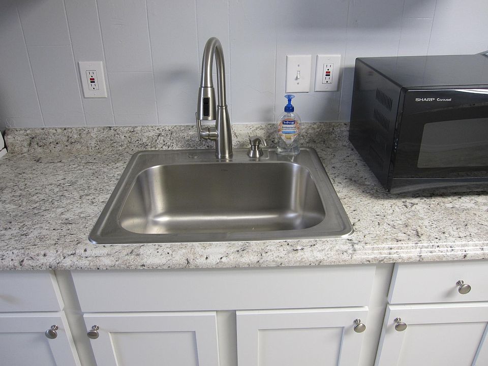 Close up picture of sink counter area.