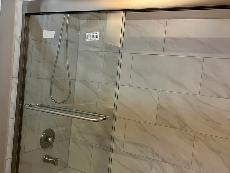 Upgraded Bathroom: 
Modern tile
Glass enclosure
Brushed nickel fixtures