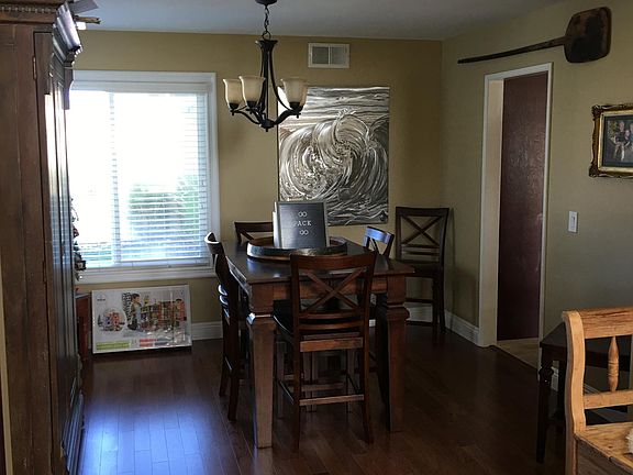Dining room next to kitchen. Front of the house has beautiful hardwood floors and large windows throughout.