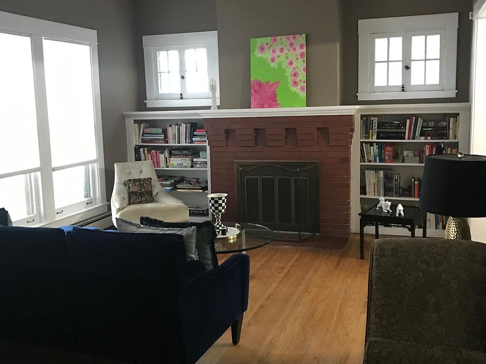 Living room with fresh nuetral wall color color and LED crystal chandelier.