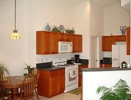 Kitchen Area with Cherry Cabinets