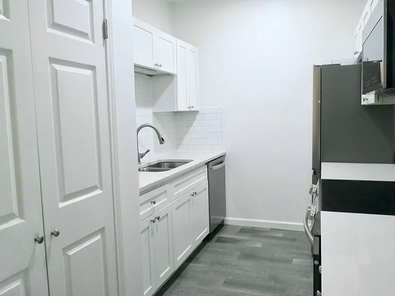 Beautifully Updated Kitchen with Quartz Countertops and Stainless Appliances