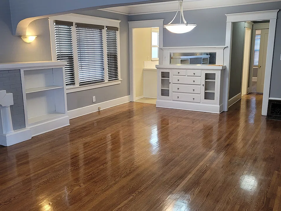 View, front door looking into dining room. Kitchen and hallway in the background.