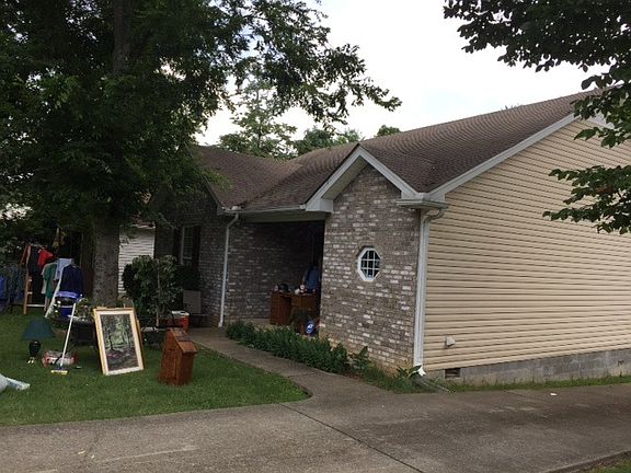 Having a yard sale :) nice brick front