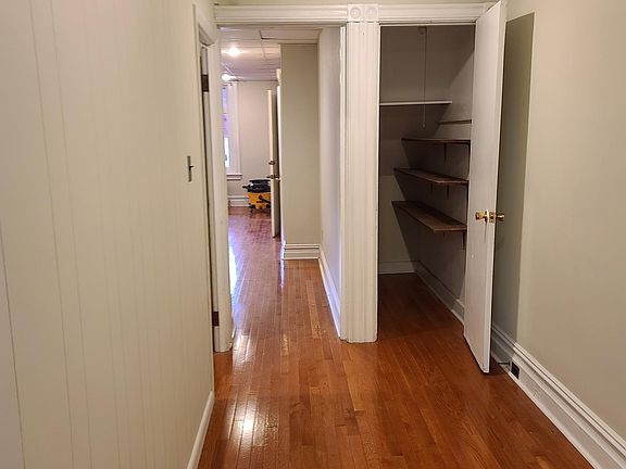 Large hallway for storage or to use as dining area with hardwood flooring throughout and central A/C and efficient gas heat.