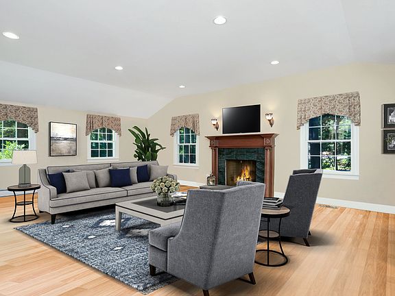 Entertain family or friends in this cozy living area with a fireplace