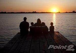 Family on the dock at sunset in VDR