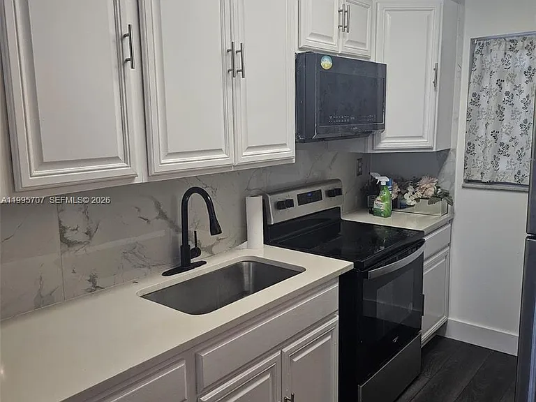 6055 W 19th Ave #209 — Photo 1