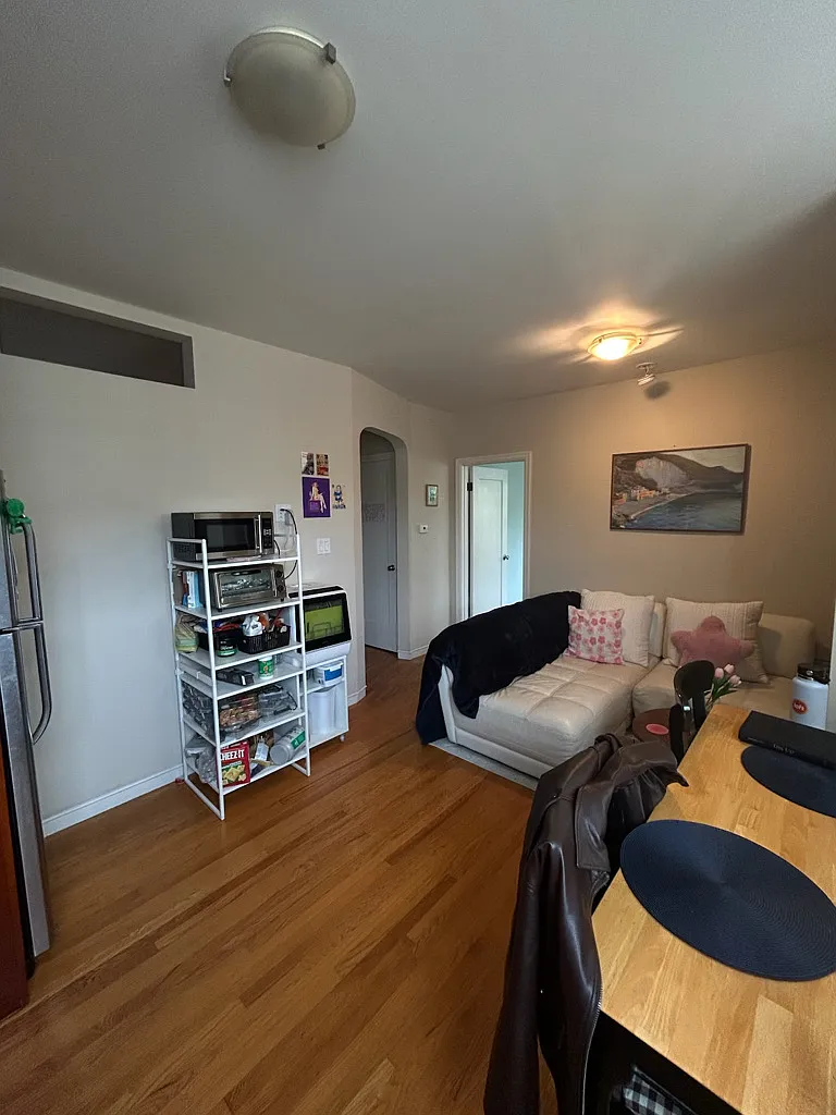 Living/dining area. Most furnishings will be available for purchase when tenant moves. - 4205 24th St #2