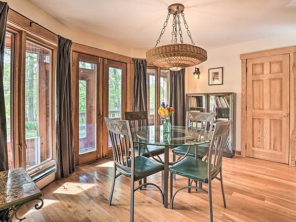 Dining area with french doors leading to screened porch