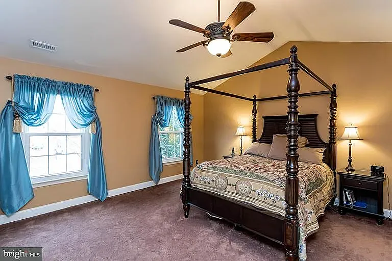 Primary Bedroom. Does not show newly painted walls, new carpet or new window treatments