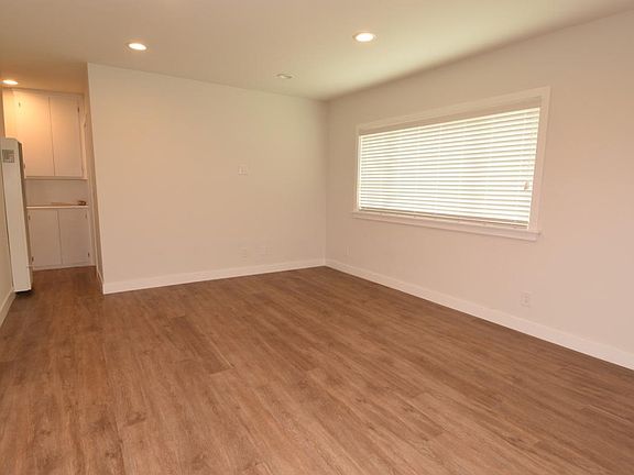Living room without furniture...has recessed LED lighting and beautiful easy maintenance flooring.
