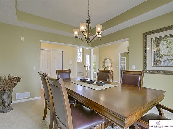To your left as you walk in is the formal Dining Room with hardwood floors.