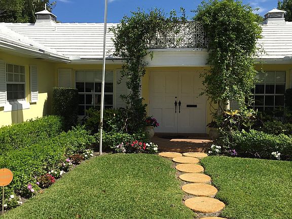 View from drive to entry through double doors.