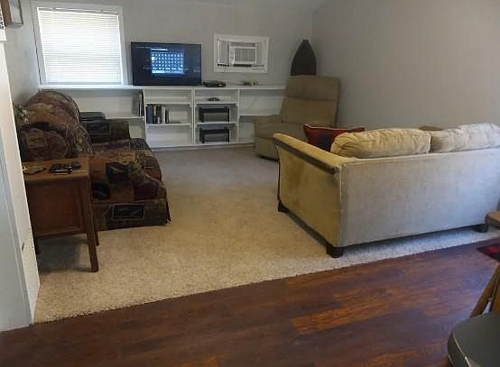 Living room with sleeper couch. Fast Wi-Fi and Amazon Fire Stick, DVD's & Selection of Board Games as well as a small library.