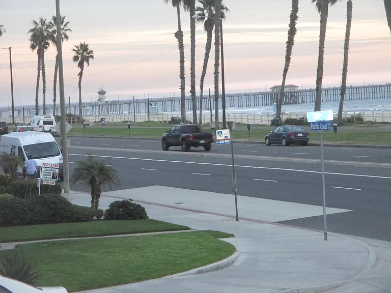 Stairs Window views of Huntington Beach PIER ( great July 4th FIREWORKS !) walking to your SECOND FLOOR cozy FURNISHED Bedroom.