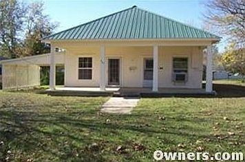 This view includes front porch and carport.