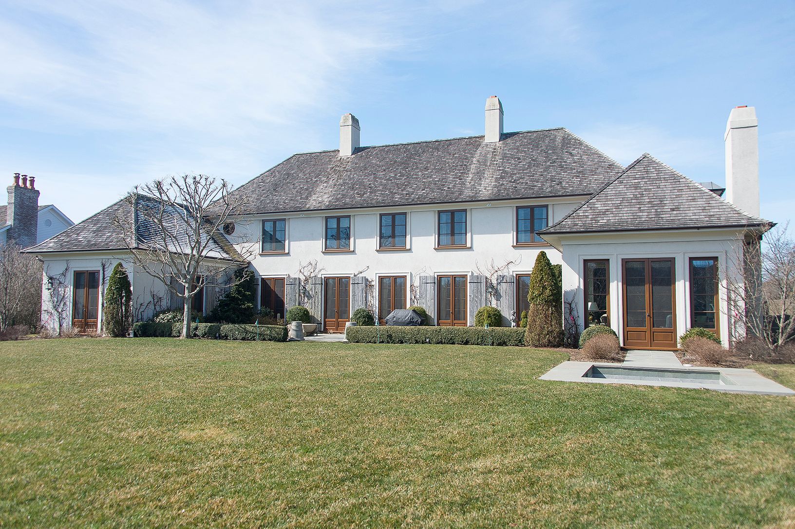  Back of House with Sunroom opening to  outdoor Spa 