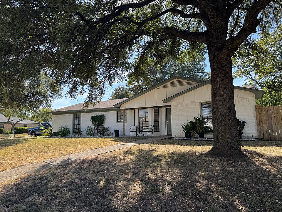 Front of Home with Large Oak Trees and Updated Landscaping