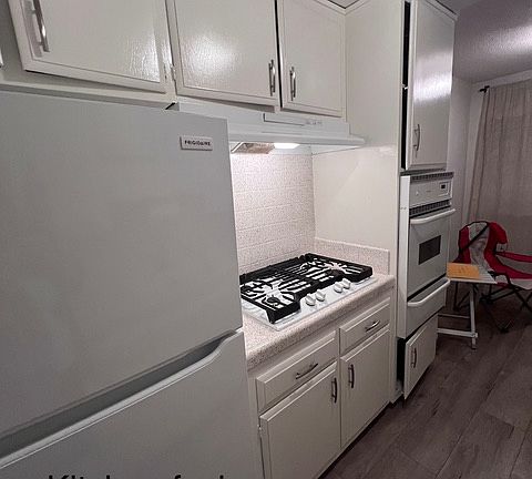 Newer full size fridge, gas stove,gas oven, dishwasher, designer faucet, garbage disposal and upgraded counter tops