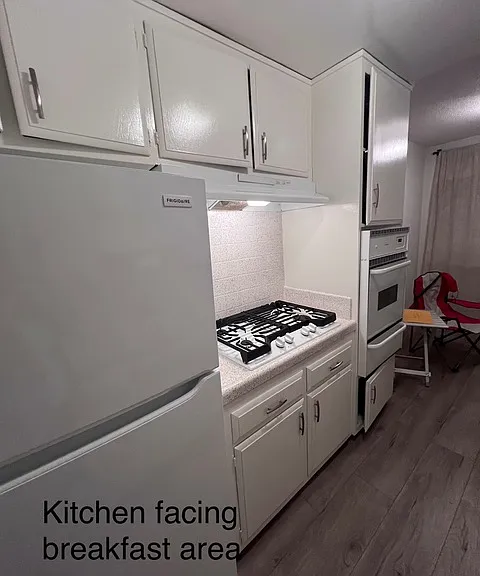 Newer full size fridge, gas stove,gas oven, dishwasher, designer faucet, garbage disposal and upgraded counter tops