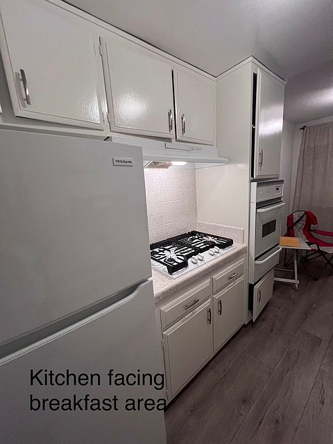 Newer full size fridge, gas stove,gas oven, dishwasher, designer faucet, garbage disposal and upgraded counter tops