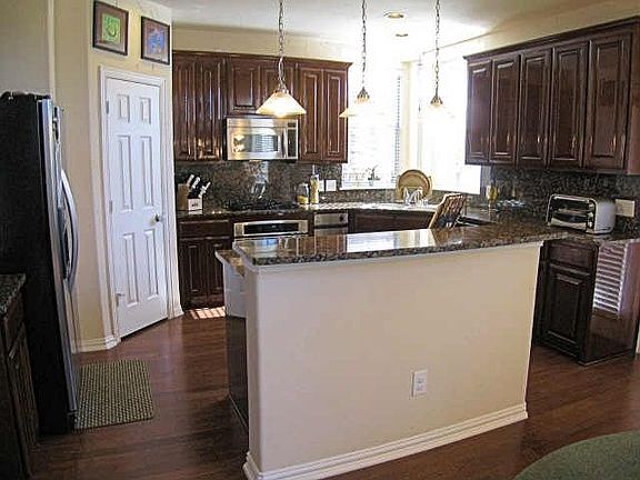 Open Kitchen w/ Stainless Steel and Granite Countertops