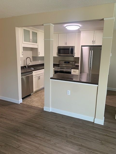 Open kitchen with stainless appliances