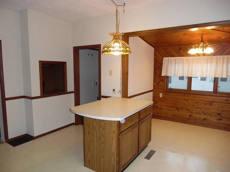 Kitchen is 14'6" x 11'3" plus 8'7" x 5'9" breakfast nook. Door in foreground is to utility room