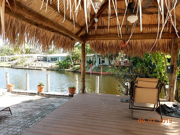 Tiki Hut in pool area with canal view