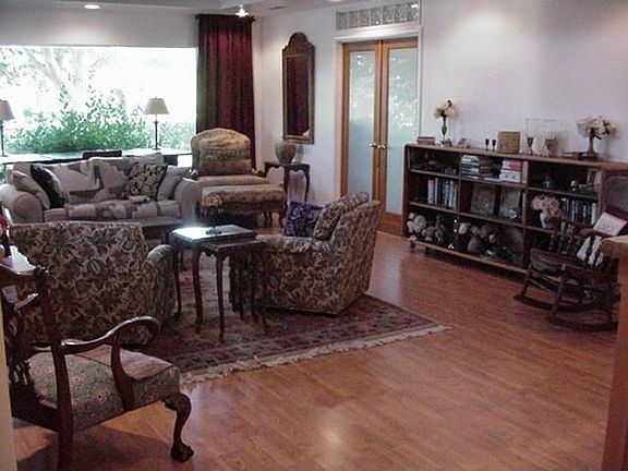 Vaulted ceiling, retro fireplace, lots of light in this living room