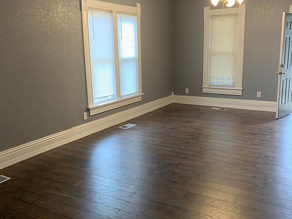 View from kitchen to front door; Living Room & Dining Area