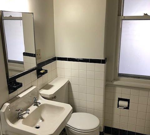 Bath with tub and shower.