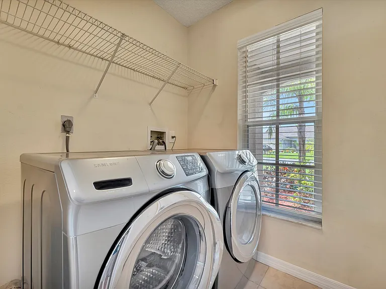 Laundry room off of garage and kitchen