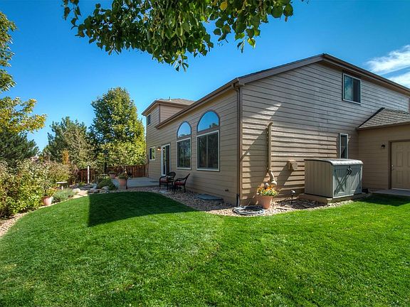 Professionally Landscaped Outdoor Living Area Perfect for Family Entertaining an