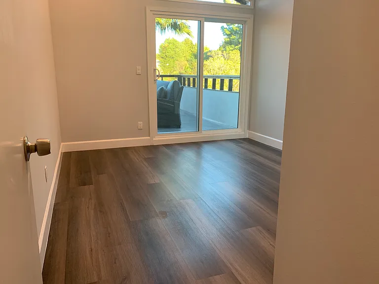 3rd bedroom with balcony and mountain views