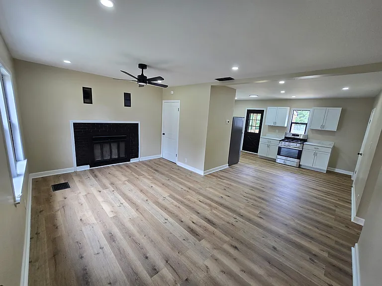 Front entrance
Open concept living room thru to kitchen.