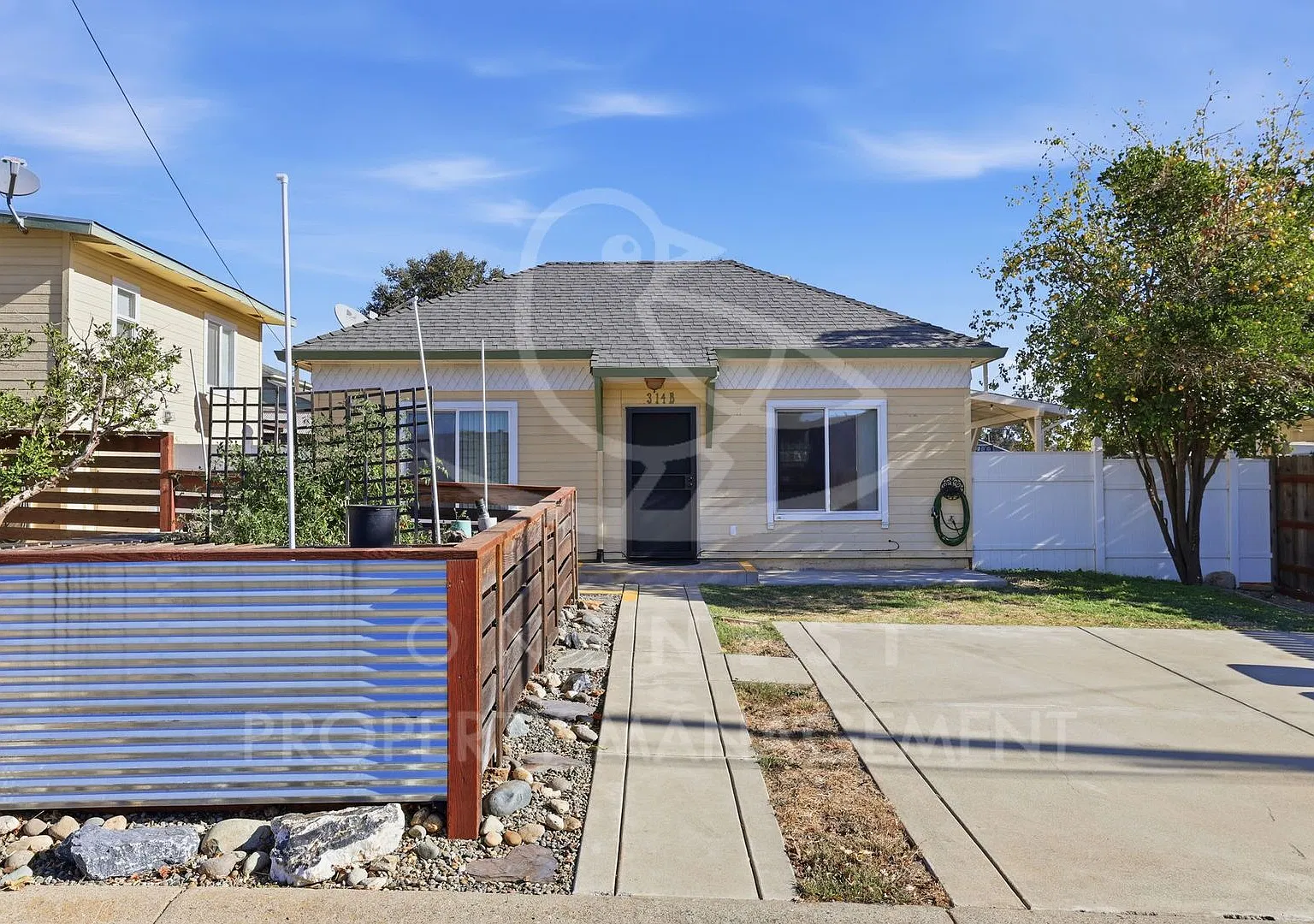 Charming 2 Bed, 1 Bath Cottage with Private Entrance, Covered Patio and Garden Beds | 314B Main S... — Photo 1