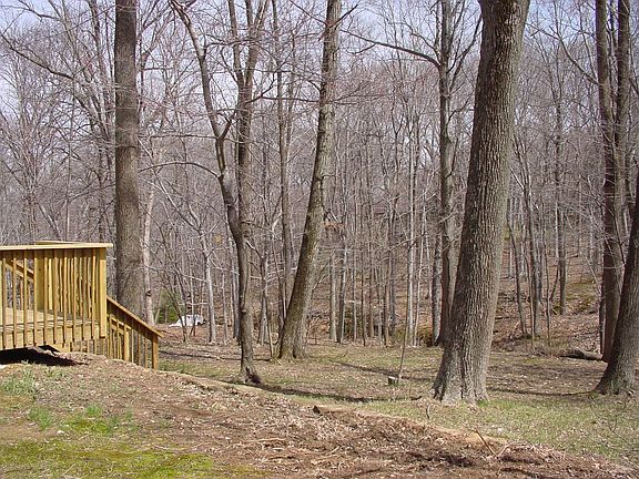 Rear Deck overlooking private tree lined yard.