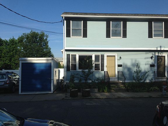 Front of house driveway to left where POD is. 
