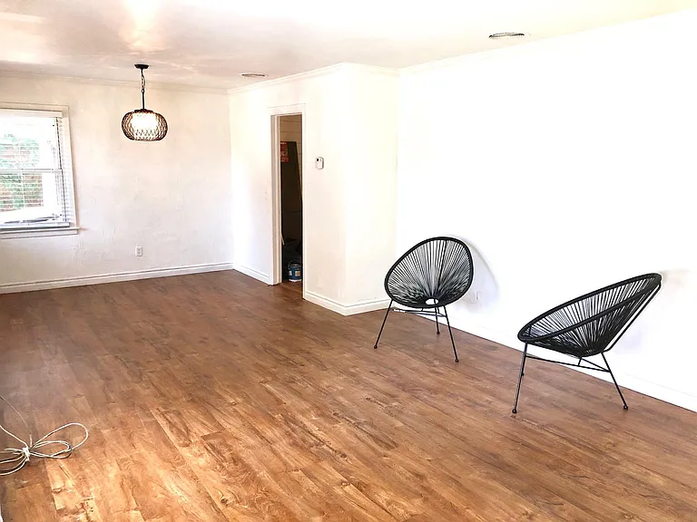 Open plan living & dining rooms. New vinyl flooring and lighting. 2" blinds throughout.