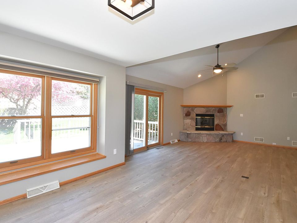 Living room with patio doors to private deck and fireplace