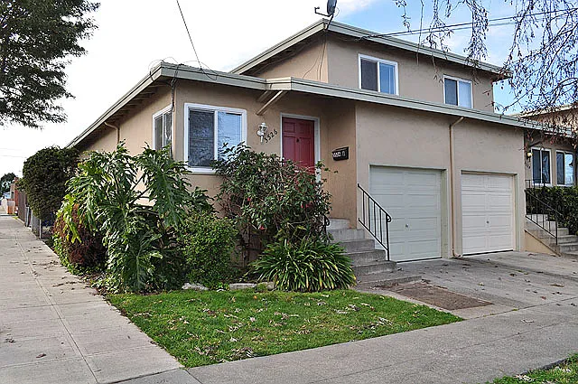 Front of building. Corner unit