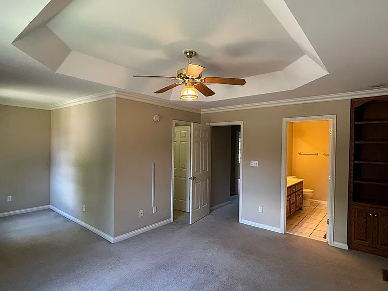 Large upstairs master suite with full bath, large walk-in closet, built-in bookshelves and sitting area.