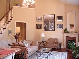 Grand staircase to second floor, fireplace
