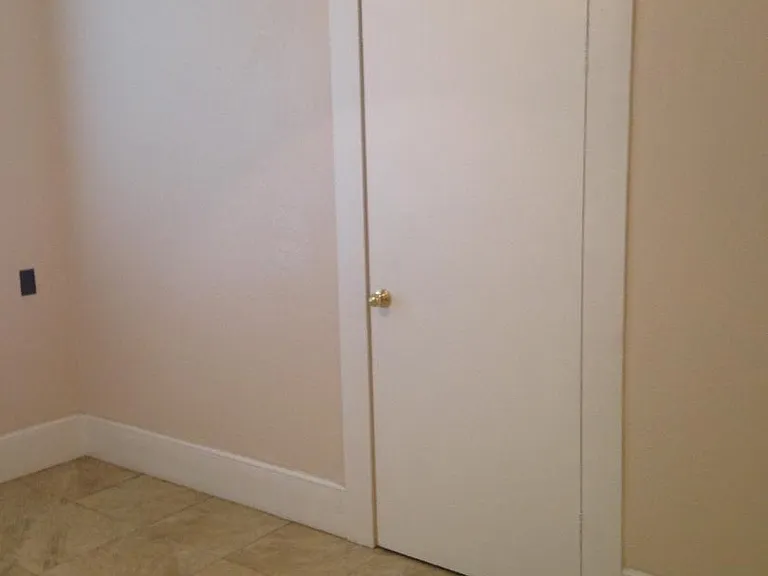 Closet in living room for storage under stairs for upstairs apartments