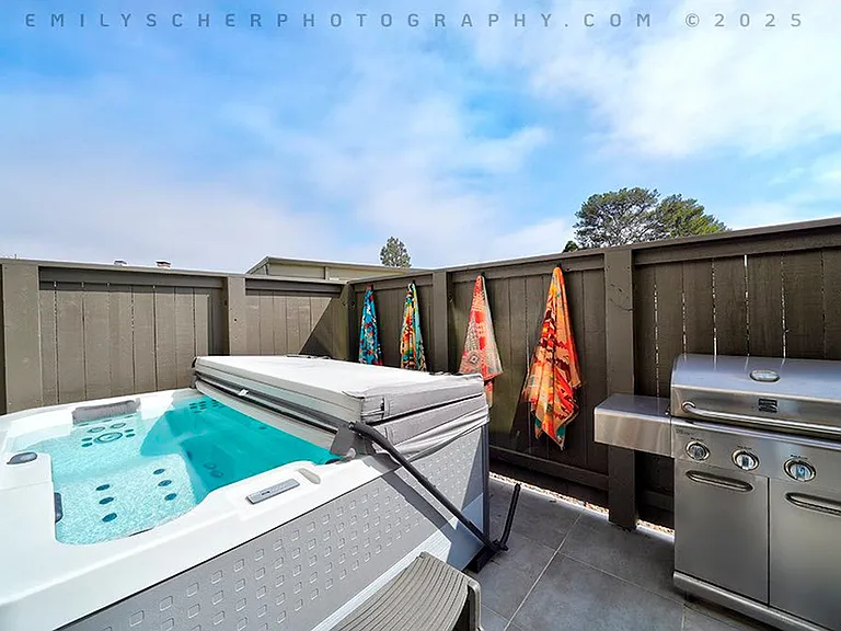 Private hot tub in enclosed back patio