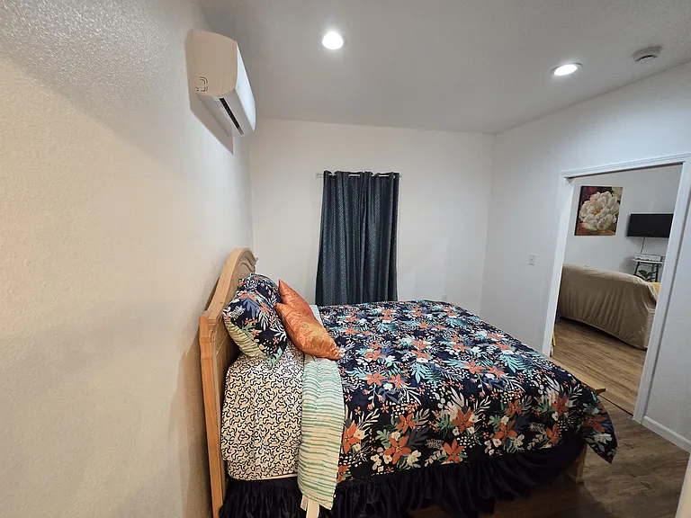Bedroom, includes queen size bed.