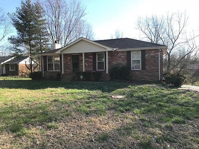 Front view of home from the road, located on quiet cul-de-sac.