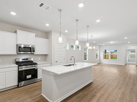 The Oakshire II- Kitchen in Dining Area and Family Room. Sample image for illustration upgrades, op